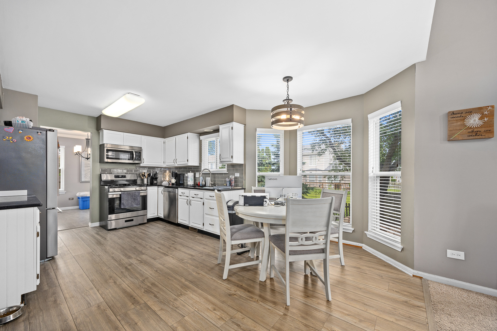 2 Buckboard Court Bolingbrook, IL 60490 - Photo 16 of 33 a view of a dining room with furniture window and wooden floor