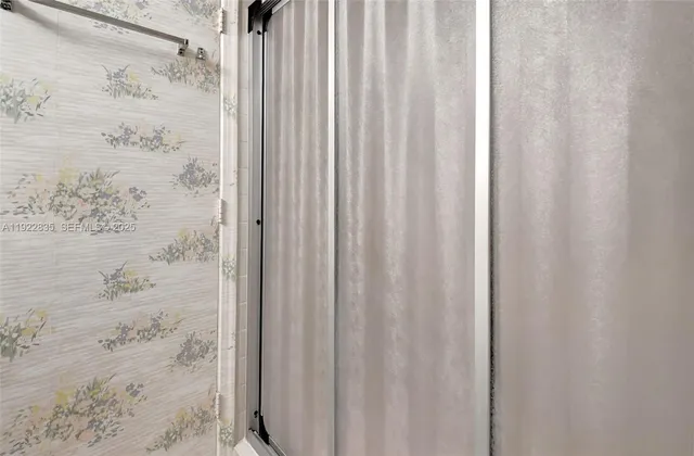 a bathroom with a shower curtain