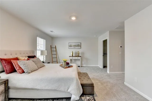 a bathroom with a tub a sink and a shower