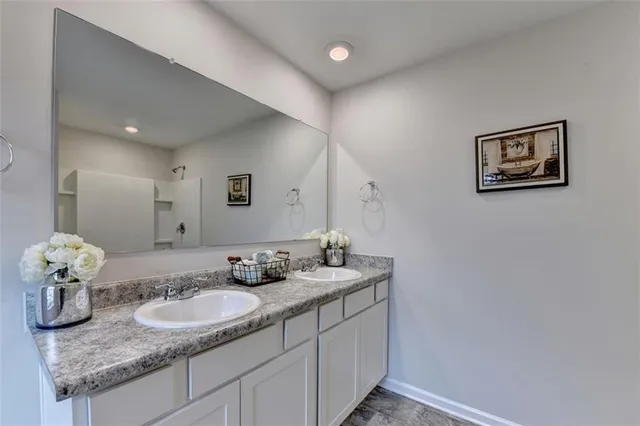 a bathroom with a bathtub and shower