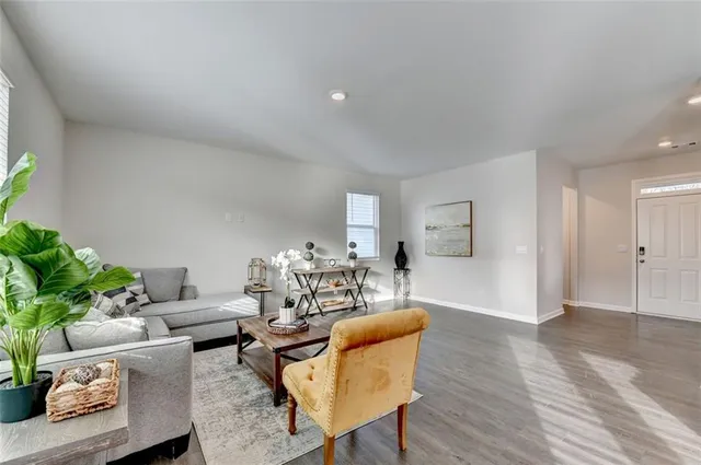 a living room with furniture and a table
