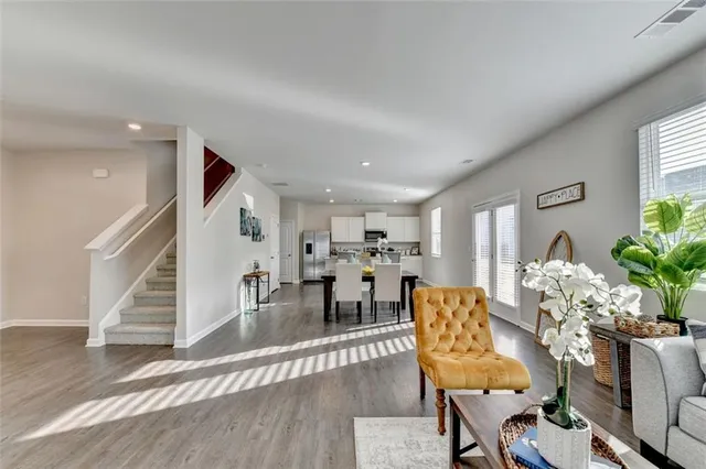 a view of a dining room with furniture and wooden floor