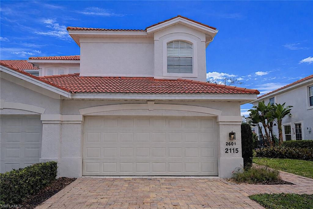 2115 Arielle Drive, Unit 2601 Naples, FL 34109 - Photo 1 of 1 a front view of a house with a garage