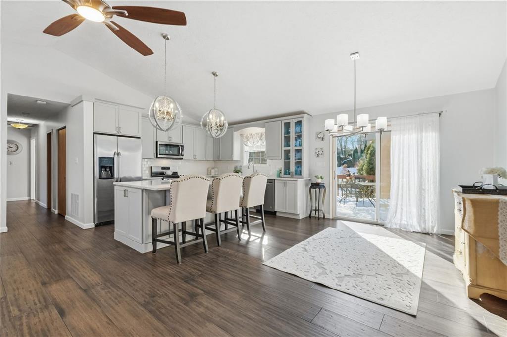 3561 Cedar Ridge Road Allison Park, PA 15101 - Photo 13 of 50 Where kitchen and dining meet, highlighted by a substantial island with beautiful barstool seating.