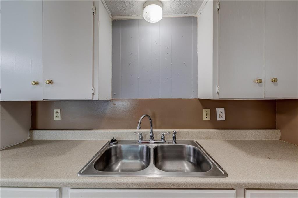 1006 Fiesta Street, Unit A Austin, TX 78702 - Photo 6 of 12 a kitchen with a sink and cabinets