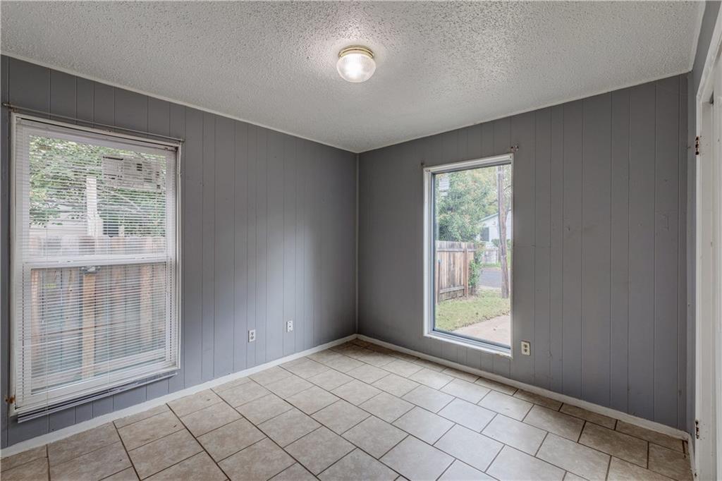 1006 Fiesta Street, Unit A Austin, TX 78702 - Photo 10 of 12 an empty room with windows