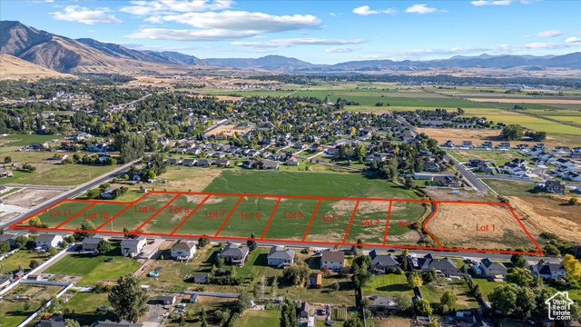 294 West 3400 South, Unit 9 Logan, UT 84321 - Photo 19 of 24 Aerial view of property and surrounding area featuring mountains and property boundaries highlighted