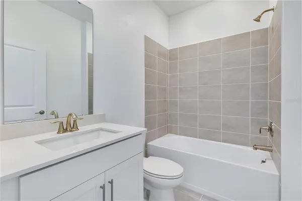 a bathroom with a sink toilet and bathtub