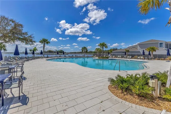 a view of a swimming pool with a patio