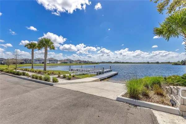 a view of a swimming pool with an outdoor seating