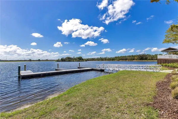 a view of a room with swimming pool and outdoor seating