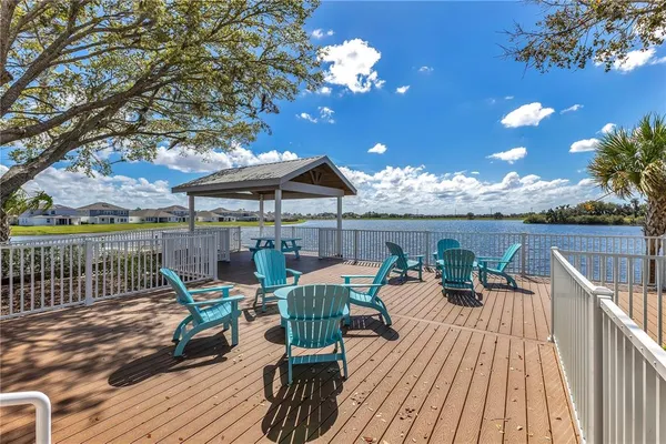 a view of a deck with furniture and tables