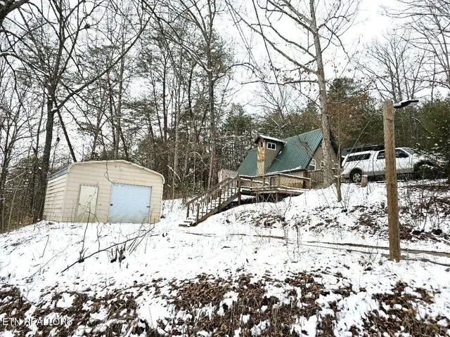 a view of a backyard of snow