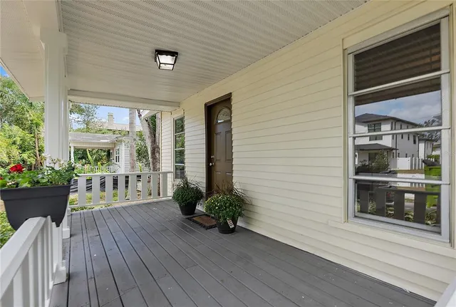 a view of a porch with wooden floor