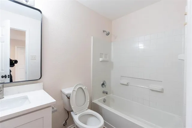 a view of an empty room and a window