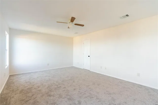a bathroom with a double vanity sink toilet and a mirror
