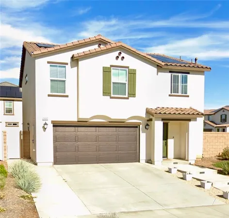 a front view of a house with a garage