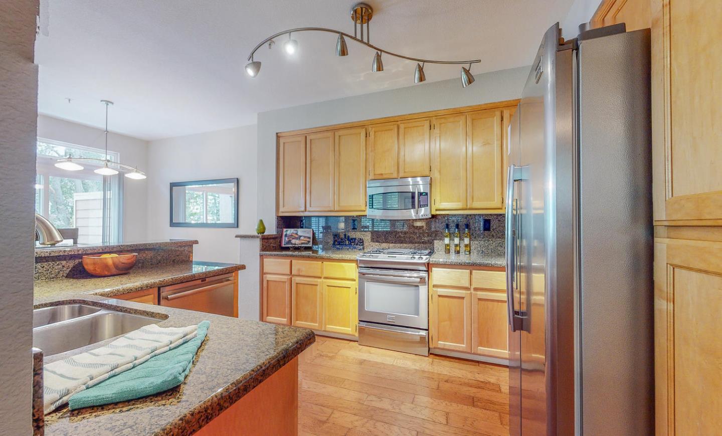 1720 Cutter Court San Ramon, CA 94583 - Photo 13 of 32 a kitchen with stainless steel appliances granite countertop a sink and a refrigerator