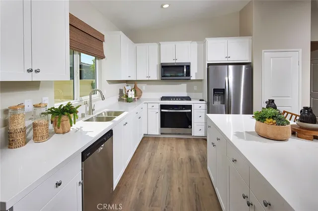 a kitchen with a sink stove and refrigerator