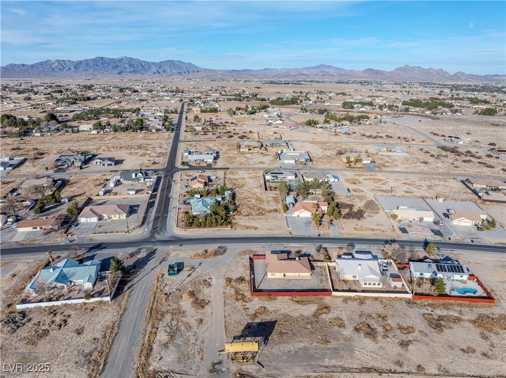 1930 South Blagg Road Pahrump, NV 89048 - Photo 8 of 11 Bird's eye view featuring a mountain view