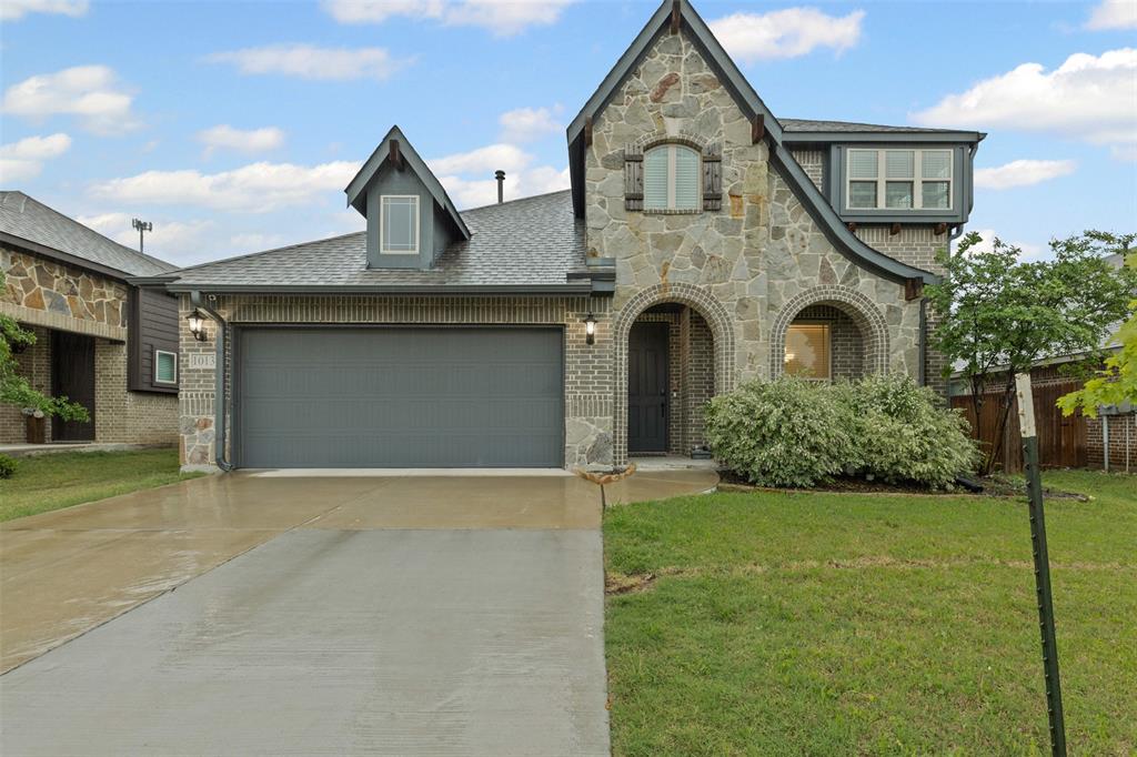 1013 Stockton Drive Godley, TX 76044 - Photo 1 of 22 a front view of a house with garden