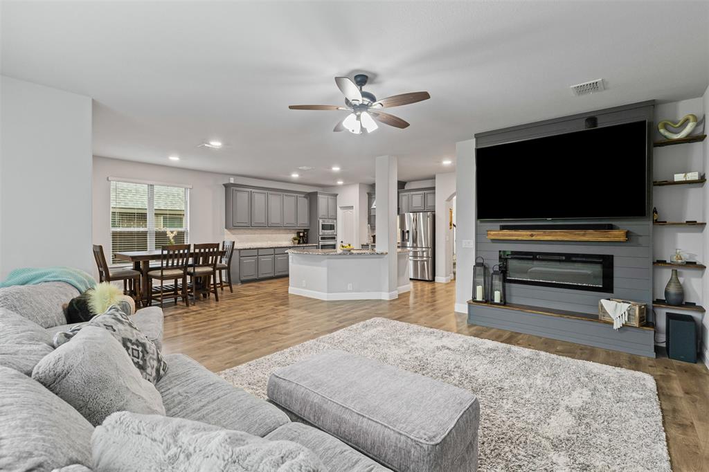 1013 Stockton Drive Godley, TX 76044 - Photo 11 of 22 a living room with furniture and a flat screen tv