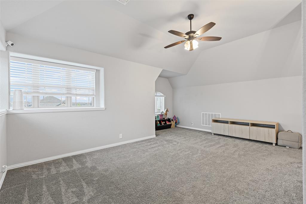 1013 Stockton Drive Godley, TX 76044 - Photo 15 of 22 a view of room with window and ceiling fan