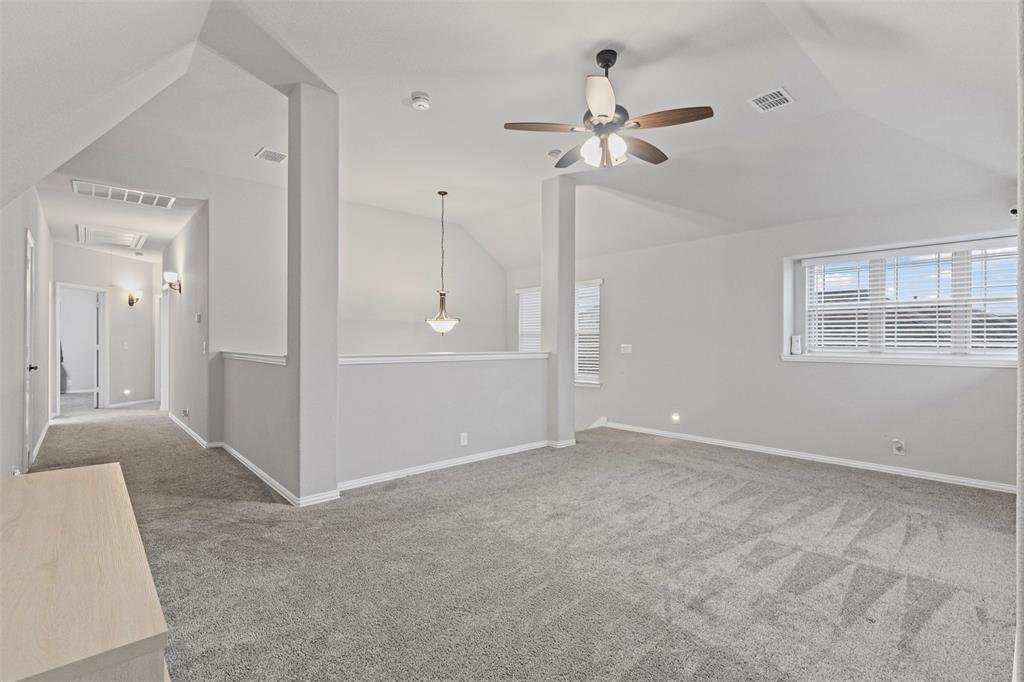 1013 Stockton Drive Godley, TX 76044 - Photo 16 of 22 an empty room with fan and windows