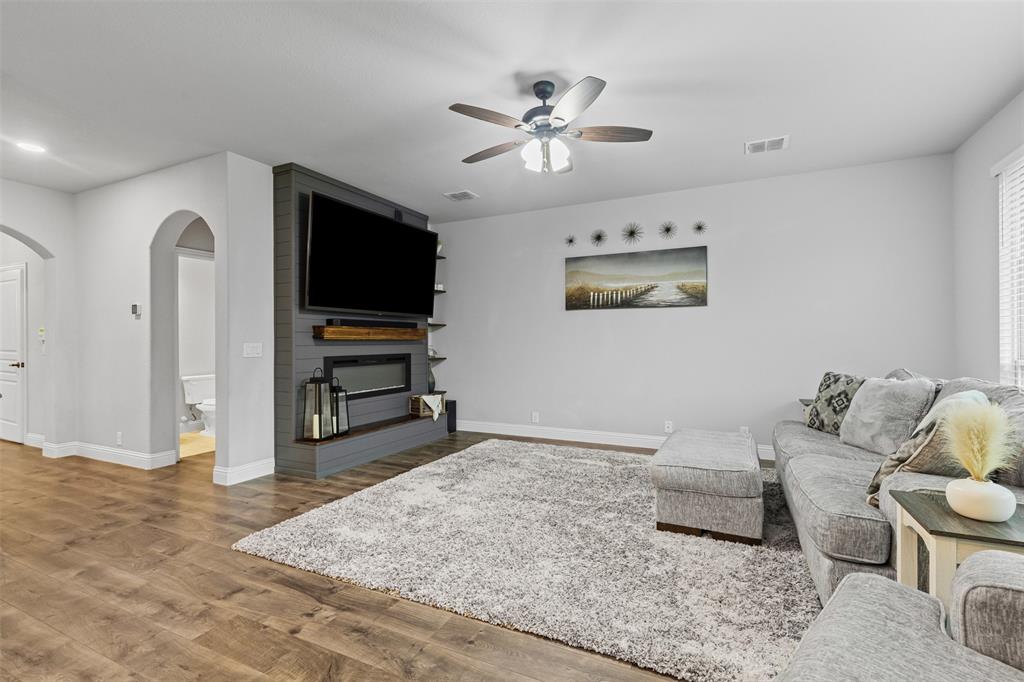 1013 Stockton Drive Godley, TX 76044 - Photo 9 of 22 a living room with furniture and a flat screen tv