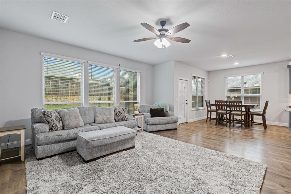 1013 Stockton Drive Godley, TX 76044 - Photo 10 of 22 a living room with furniture and a large window