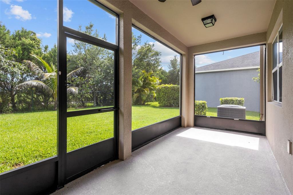 12124 Lake Boulevard Trinity, FL 34655 - Photo 15 of 31 a view of a room with a large window and front door