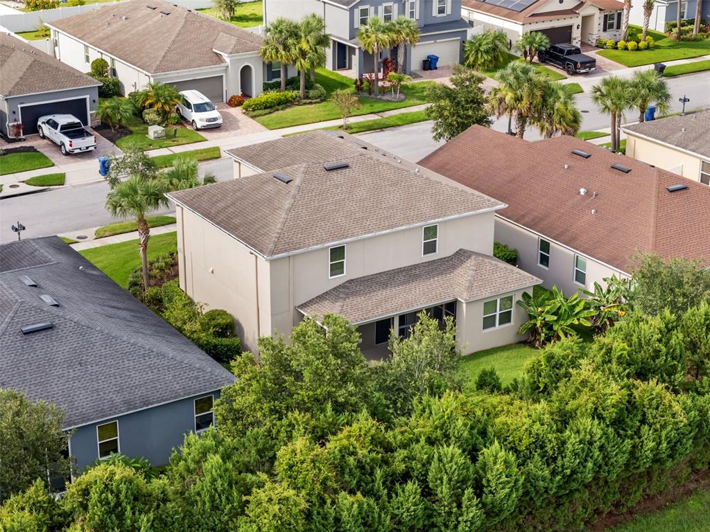 12124 Lake Boulevard Trinity, FL 34655 - Photo 16 of 31 an aerial view of a house with a yard and lake view