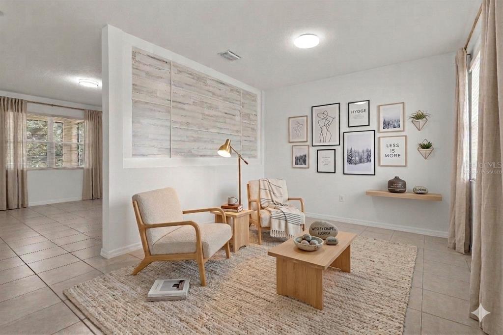 12124 Lake Boulevard Trinity, FL 34655 - Photo 2 of 31 a living room with furniture and wooden floor