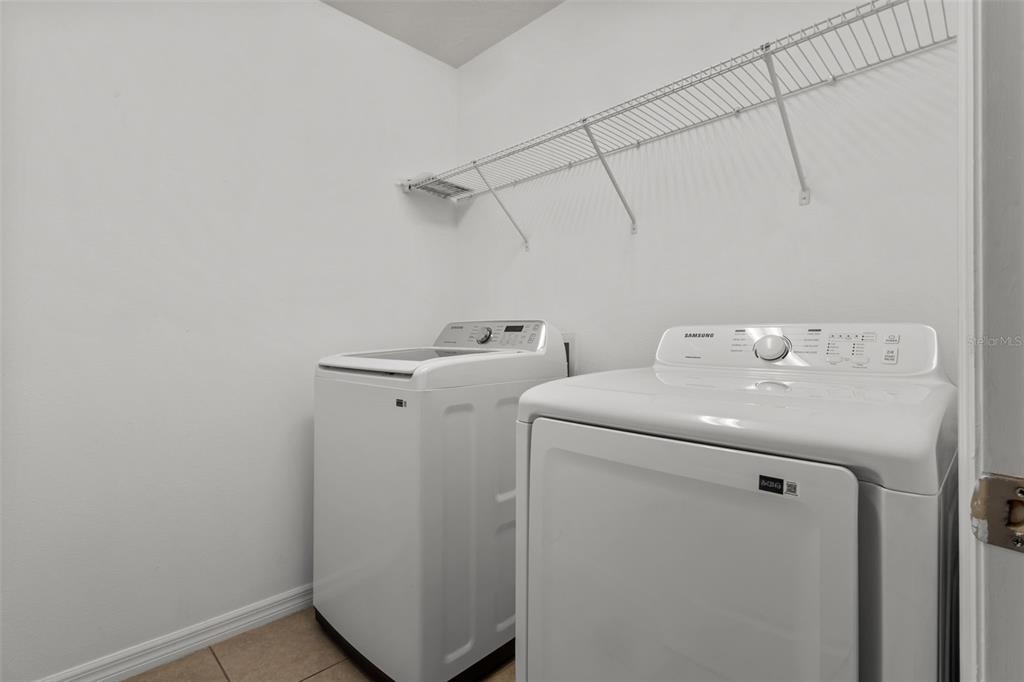 12124 Lake Boulevard Trinity, FL 34655 - Photo 25 of 31 a utility room with dryer and washer