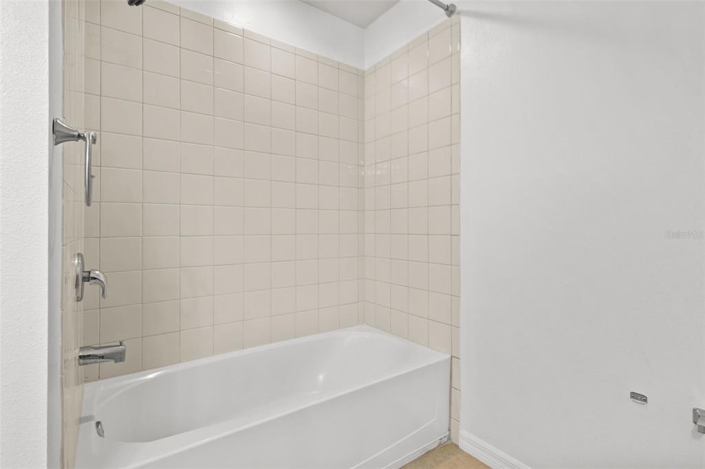 12124 Lake Boulevard Trinity, FL 34655 - Photo 26 of 31 a bathroom with a bathtub