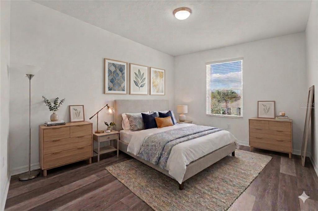 12124 Lake Boulevard Trinity, FL 34655 - Photo 7 of 31 a bedroom with a bed and a window