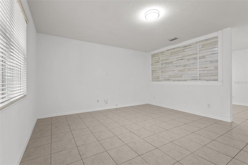 12124 Lake Boulevard Trinity, FL 34655 - Photo 9 of 31 an empty room with windows