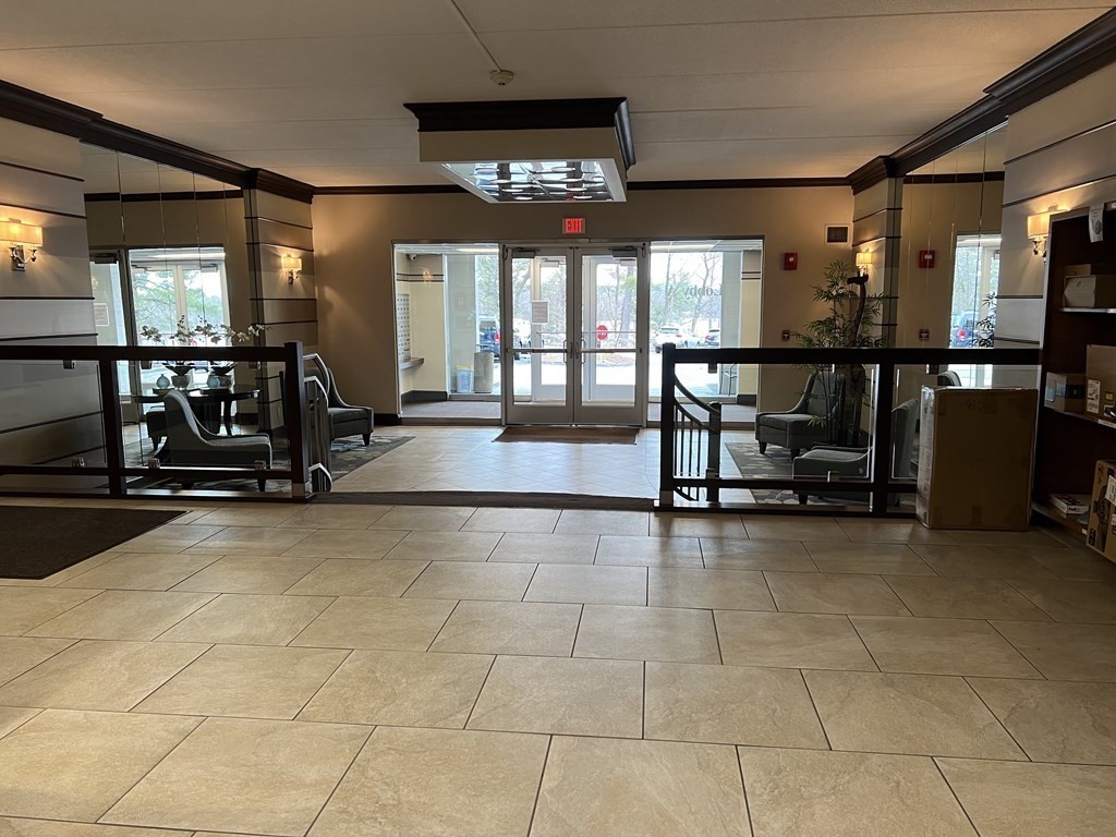1550 Worcester Road, Unit 114 Framingham, MA 01702 - Photo 19 of 29 a view of a room with gym equipment