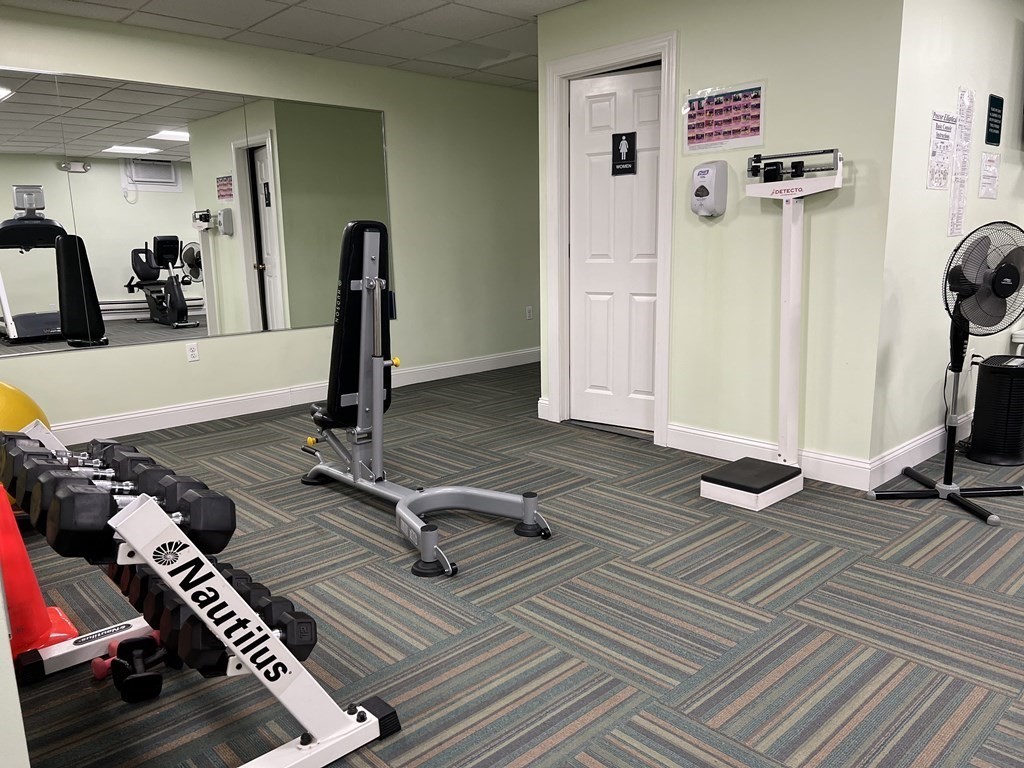 1550 Worcester Road, Unit 114 Framingham, MA 01702 - Photo 26 of 29 a view of a room with gym equipment