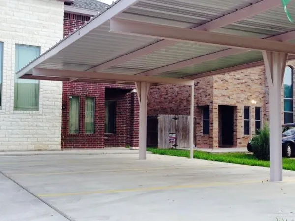 a front view of building with yard