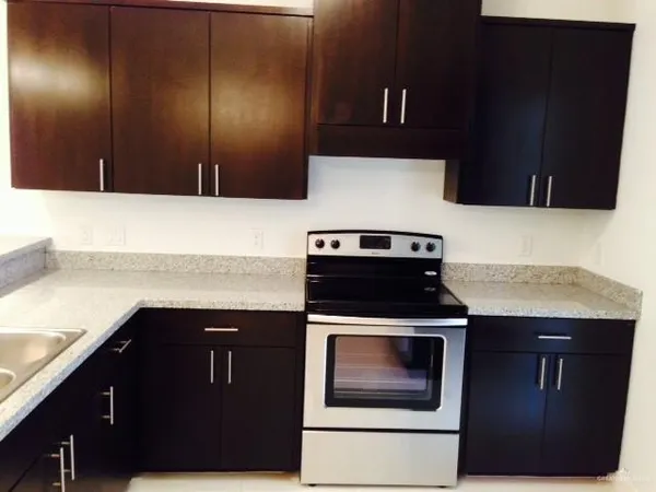 a kitchen with a stove and a microwave