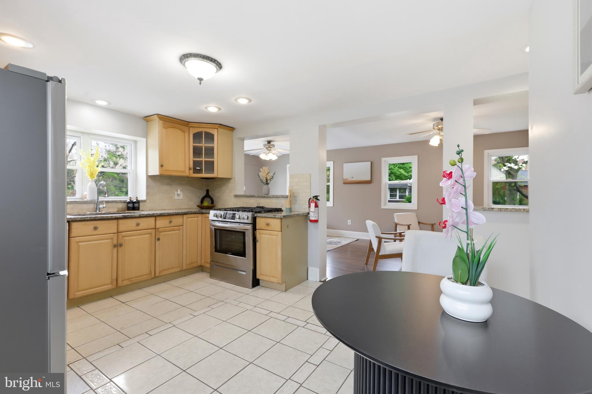 718 Chestnut Avenue Laurel Springs, NJ 08021 - Photo 13 of 49 a kitchen with a table and chairs