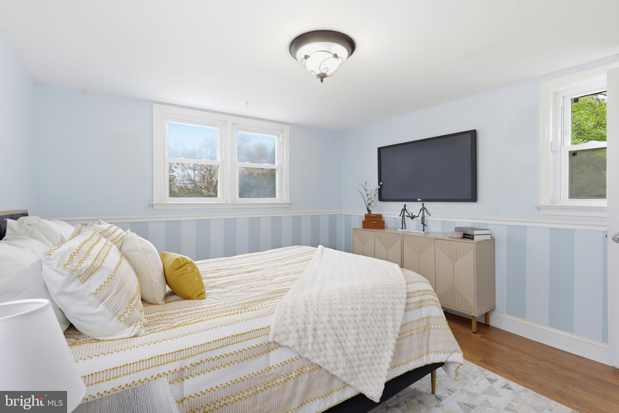 718 Chestnut Avenue Laurel Springs, NJ 08021 - Photo 24 of 49 a bedroom with a bed and a flat screen tv