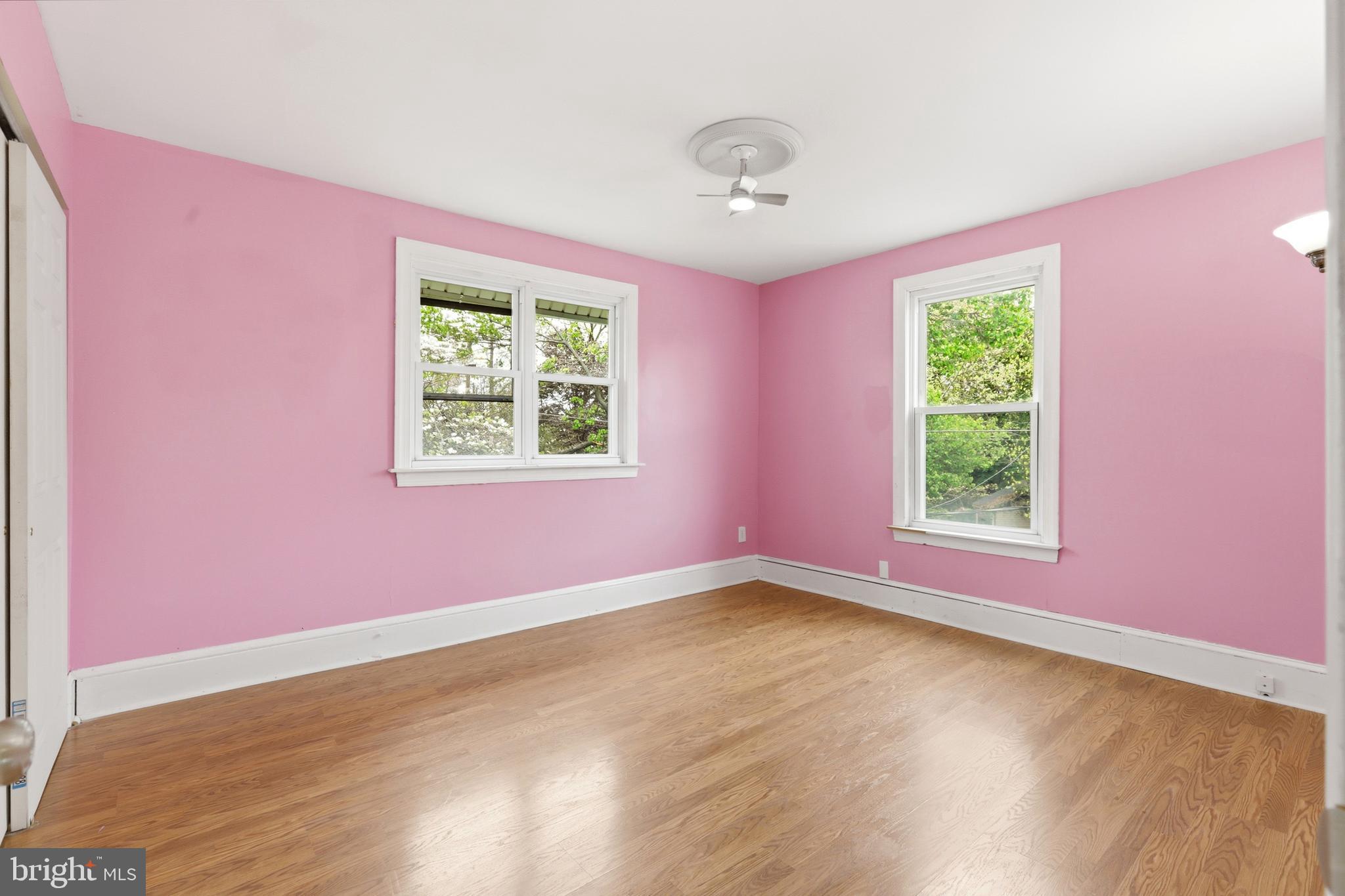 718 Chestnut Avenue Laurel Springs, NJ 08021 - Photo 31 of 49 a view of a bedroom with wooden floor and windows