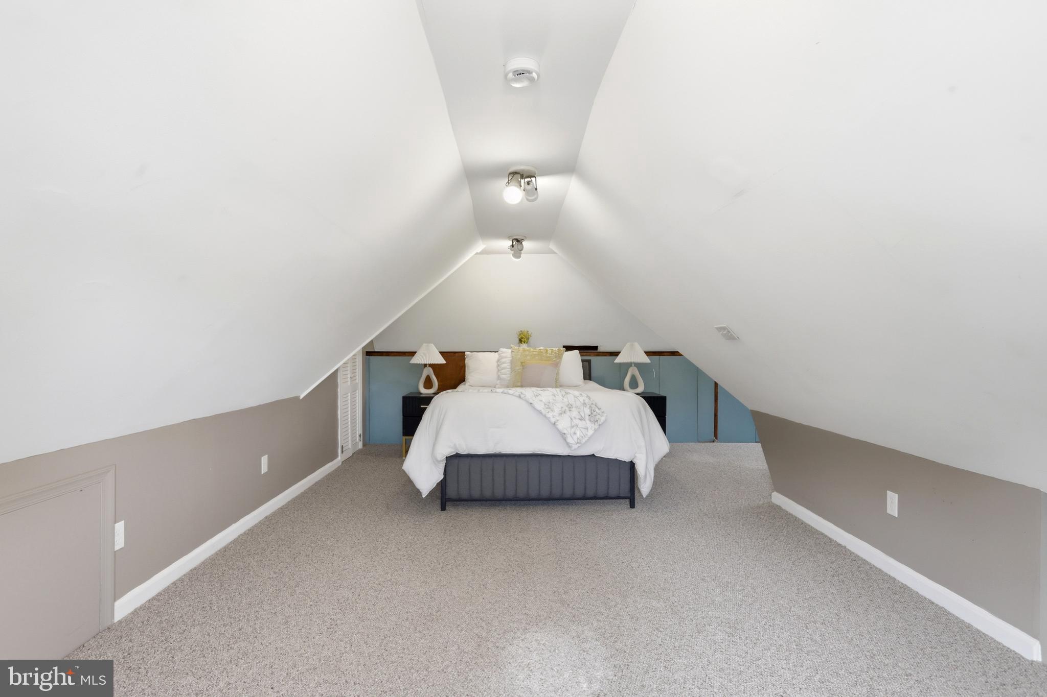 718 Chestnut Avenue Laurel Springs, NJ 08021 - Photo 35 of 49 a spacious bedroom with a bed and a lamp