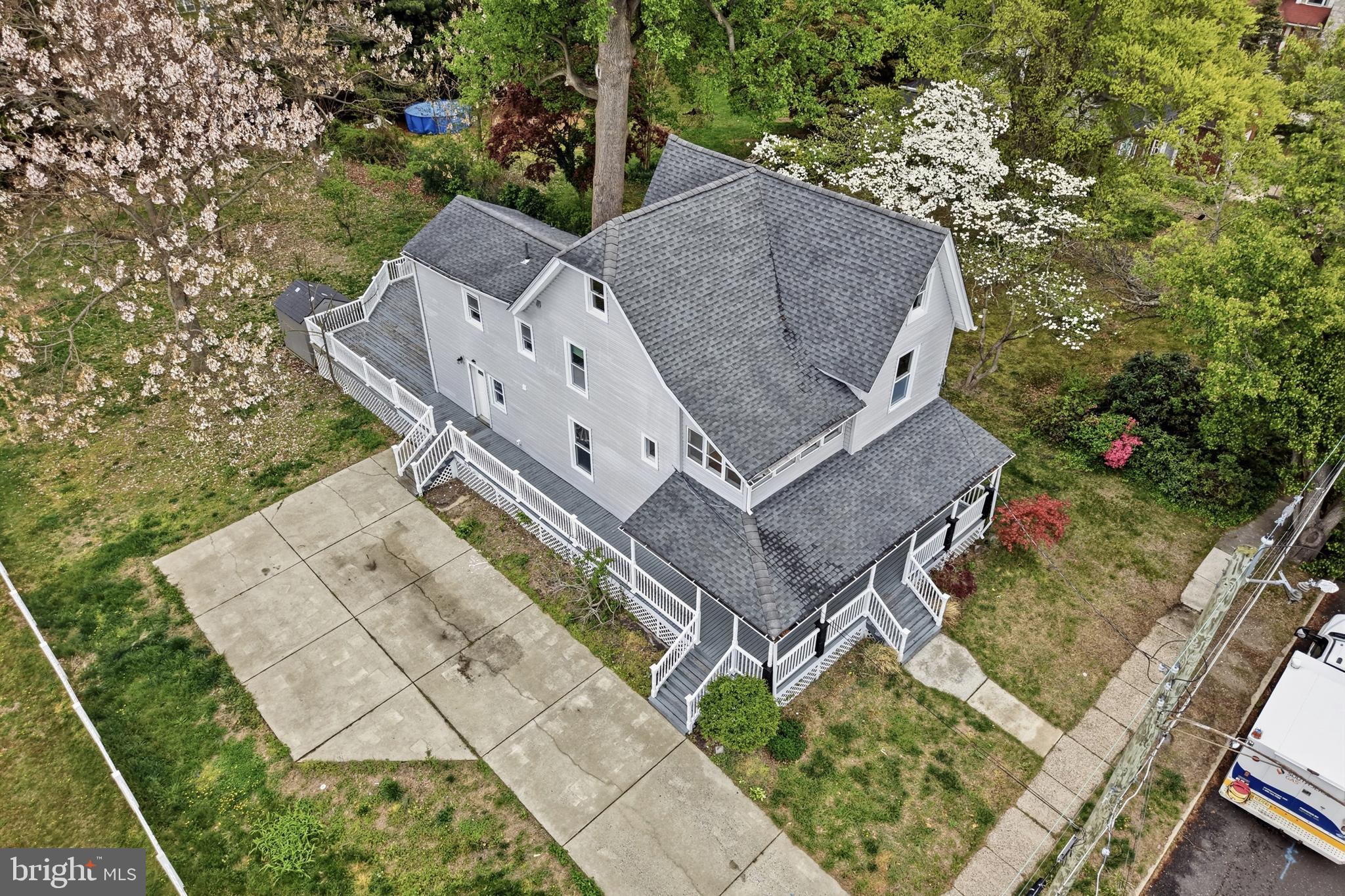 718 Chestnut Avenue Laurel Springs, NJ 08021 - Photo 43 of 49 an aerial view of a house with a yard and large trees