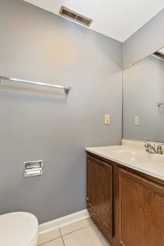a bathroom with a sink and vanity
