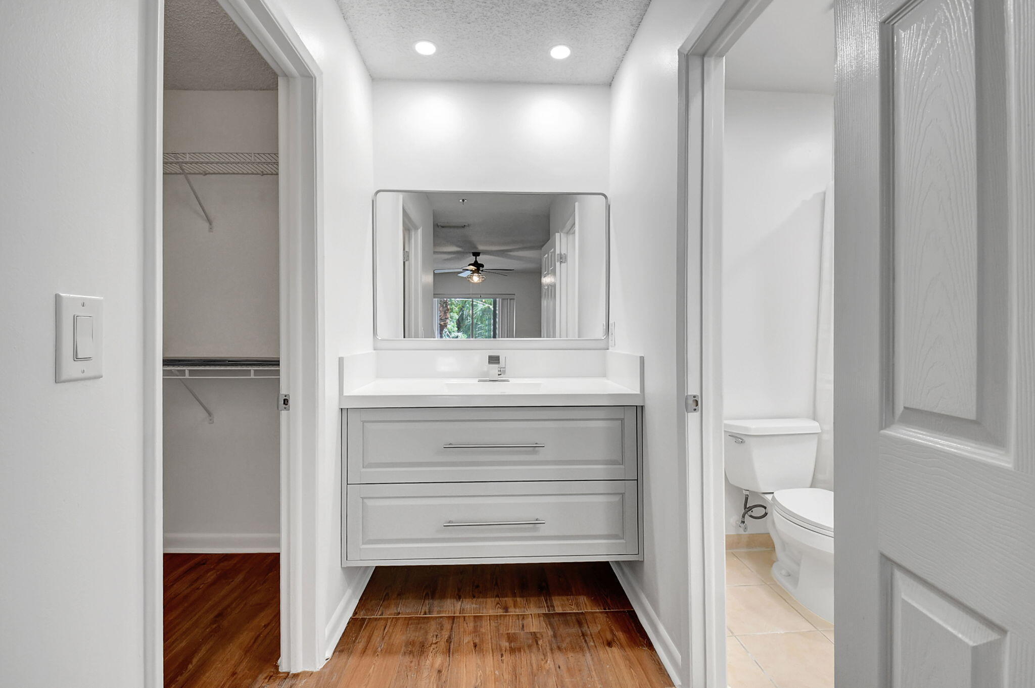 3207 Clint Moore Road, Unit 206 Boca Raton, FL 33496 - Photo 18 of 54 a bathroom with a sink and a mirror