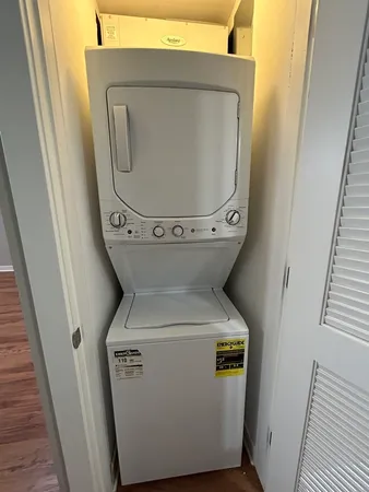 a view of room with wooden floor