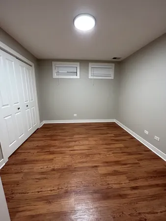 a view of walk in closet with wooden floor